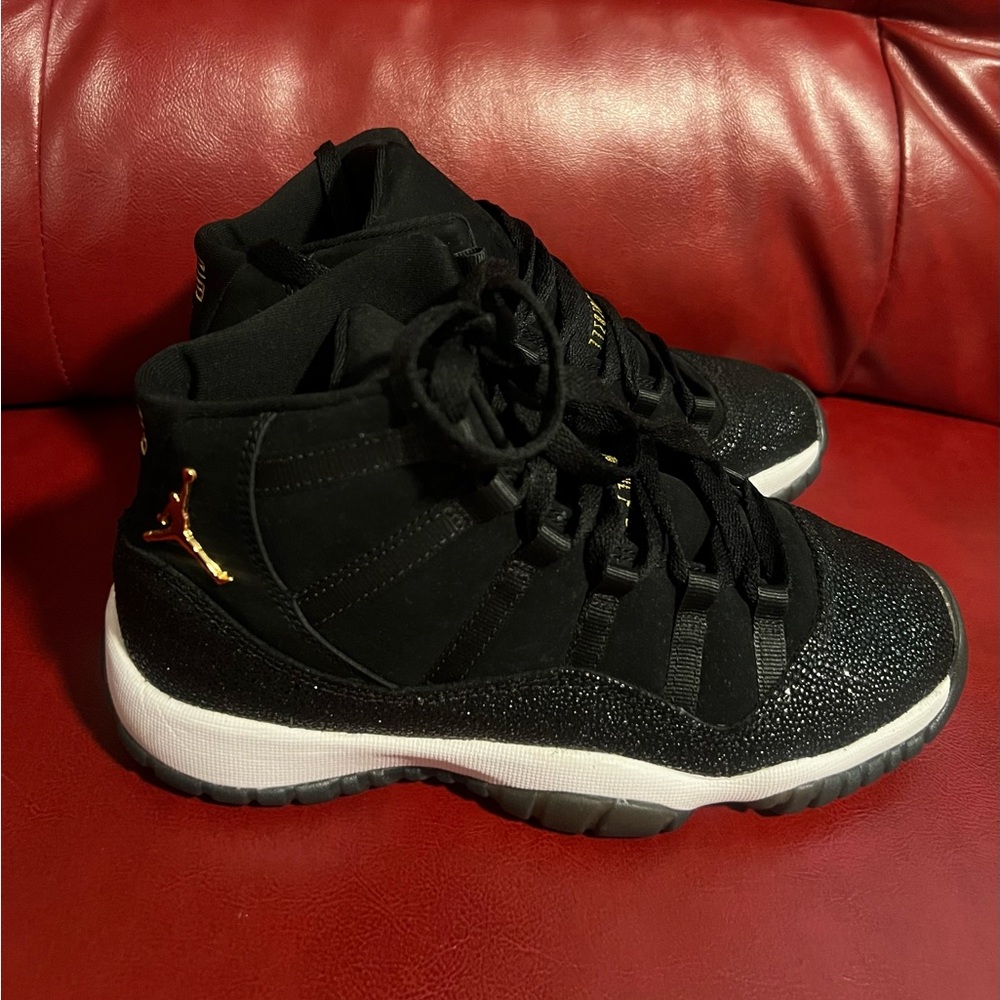 Jordan 11 Retro Black and Gold Sneakers